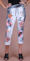 Women's cropped pants with zebra print, floral and geometric patterns, and 'joie de vivre' text