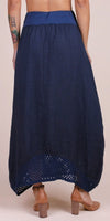 Back view of navy blue linen maxi skirt with crochet hem and high waist, worn with heels