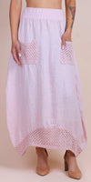 Light pink linen maxi skirt with crochet pockets and hem, worn with nude heels