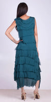 Woman wearing teal sleeveless tiered dress with frayed edges, back view, high heels
