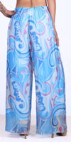 Woman wearing flowy blue paisley print palazzo pants with sheer lightweight fabric