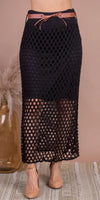 Black crochet midi skirt with a wide brown belt and nude heels, boho chic style