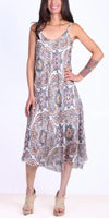 Woman wearing sleeveless midi dress with beige, blue, and floral geometric print