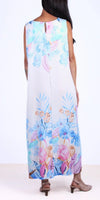 Back view of woman in sleeveless maxi dress with blue and pink floral print, open keyhole detail