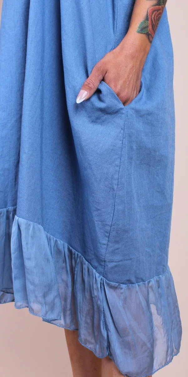 Blue linen midi dress with sheer ruffle hem and side pocket detail