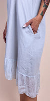Light grey linen dress with pleated sheer hem and side pocket detail