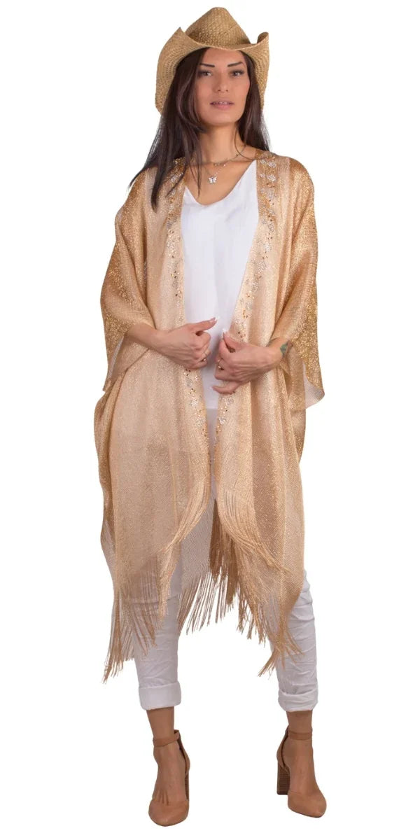 Woman in a golden fringe kimono, white outfit, brown heels, and straw hat