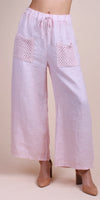 Light pink linen wide-leg pants with crochet patch pockets and drawstring waist
