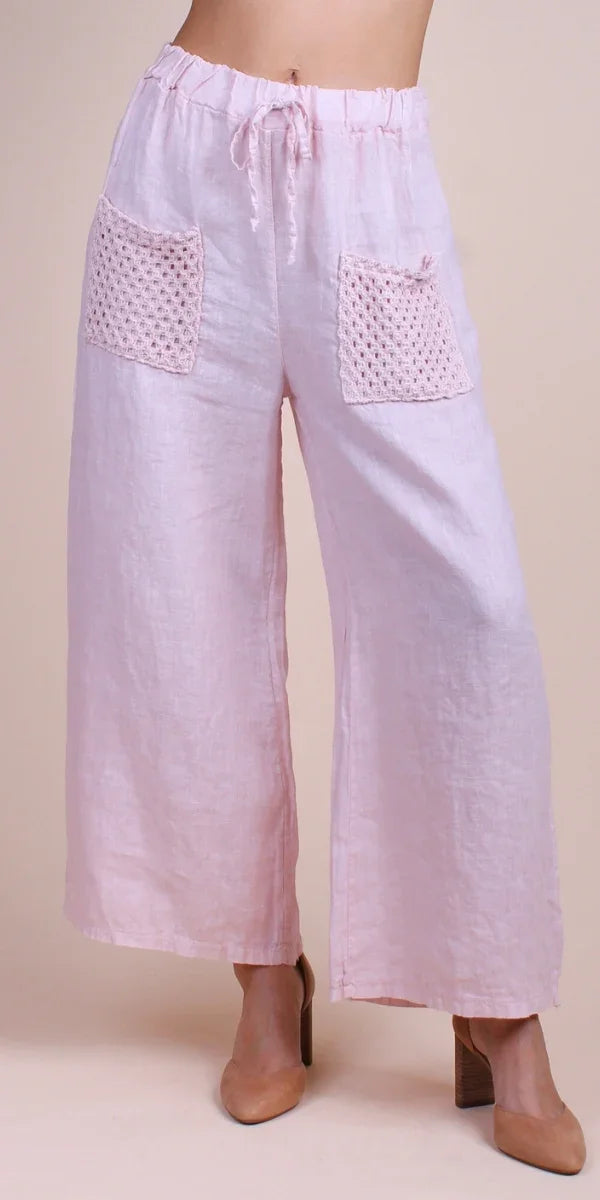 Light pink linen wide-leg pants with crochet patch pockets and drawstring waist