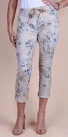 Women's beige floral print cropped pants with tie waist and rolled cuffs