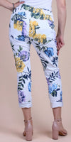 White cropped floral pants with yellow, blue, and purple flowers, shown from the back