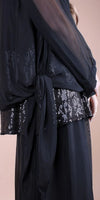 Black sheer blouse with sequin details and waist tie, elegant women's fashion